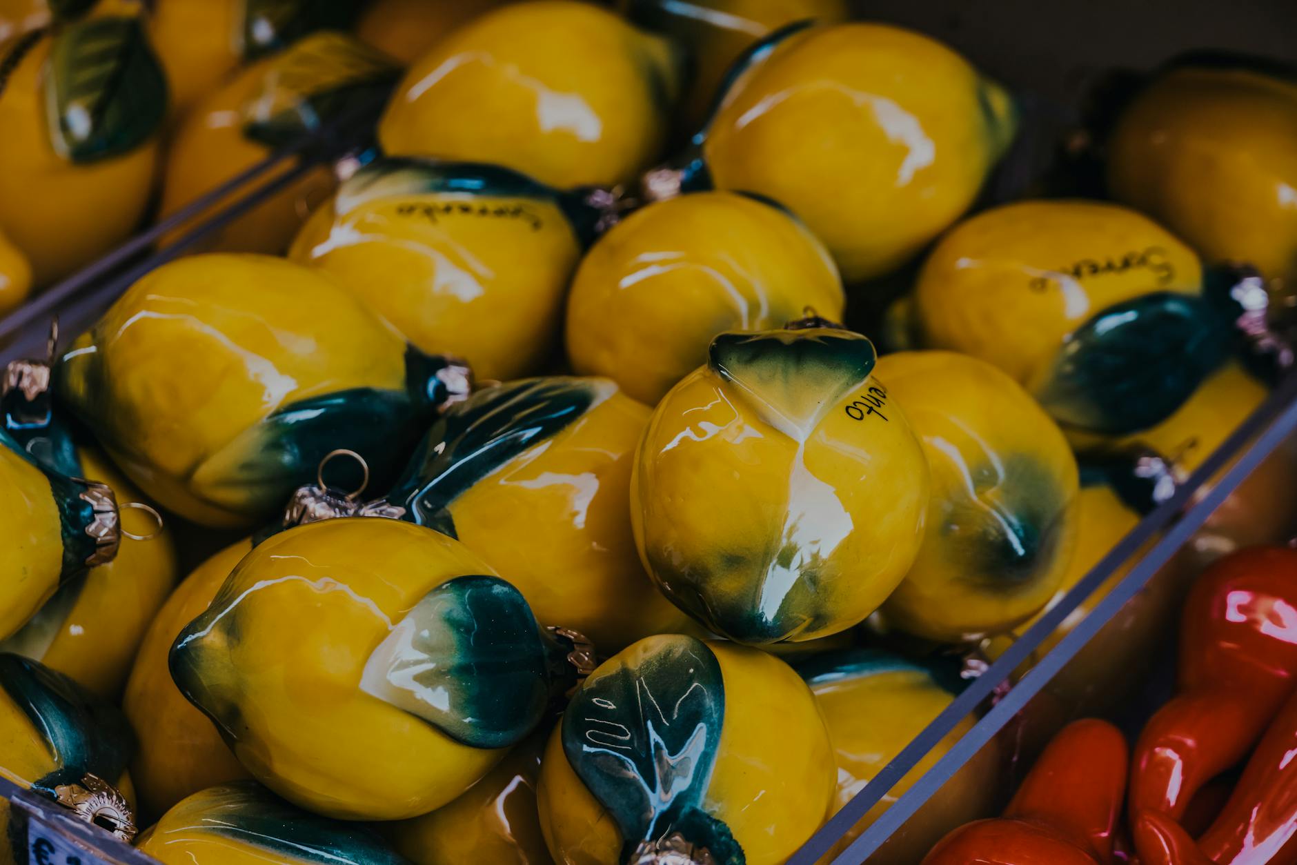 Vibrant yellow ceramic lemons artfully displayed, symbolizing the Lem vibrator and fresh approach to couples pleasure.